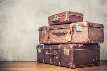 Vintage old classic travel leather suitcases circa 1940s. Travel luggage concept. Retro instagram style filtered photo