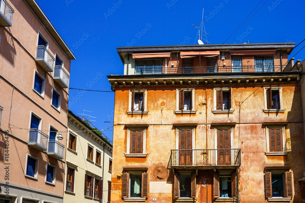 Streets and buildings of Verona city at the sunny summer day.  Because of the value of its historical buildings, Verona has been named a UNESCO World Heritage Site