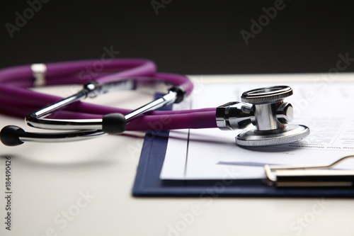 Closeup of a medical stethoscope with folder