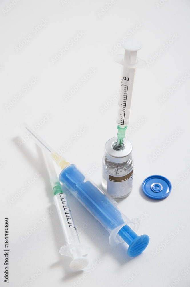 ampoule and syringe on white background, medical and health theme ampoule and syringe on white background, medical and health theme