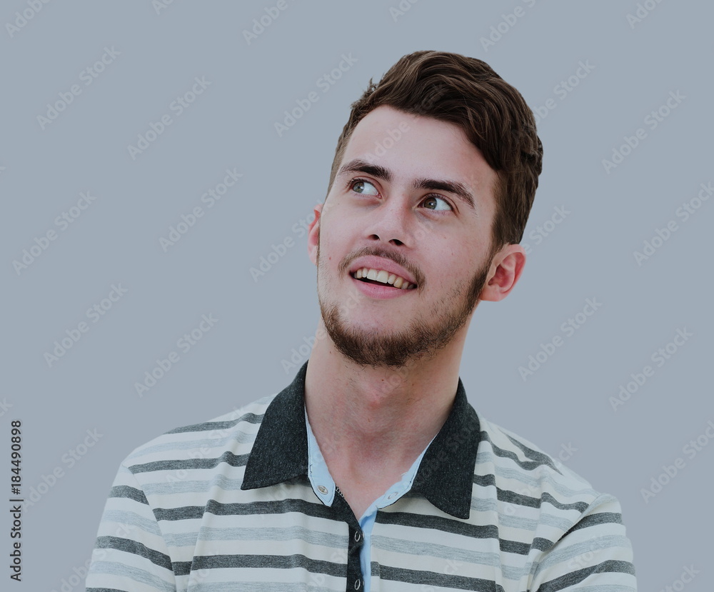 Closeup portrait of pensive handsome smiling man looking up in s Closeup portrait of pensive handsome smiling man looking up in s
