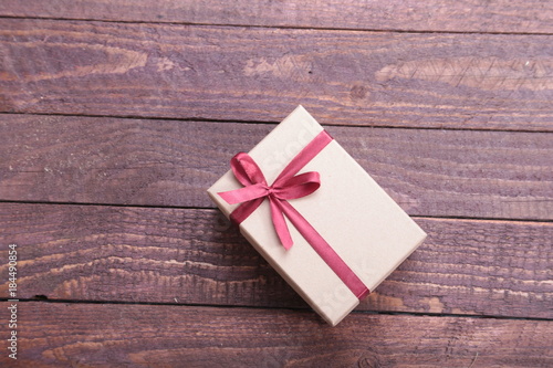 Gift boxes with bow on wood background