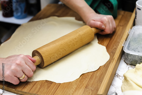 rolling the dough on dumplings