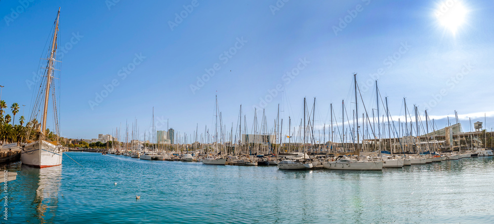 Harbor in Barcelona, boats and yachts on turquoise water