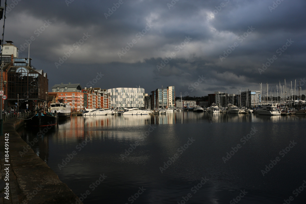 Ipswich waterfront marina with storm clouds