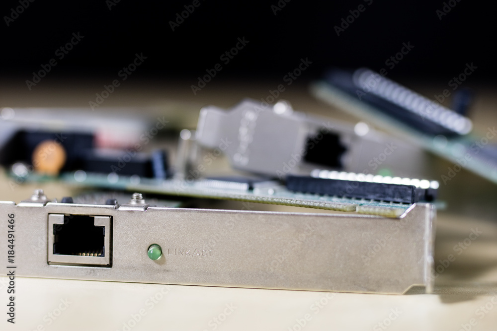 old network cards for desktop computers. Network cards with rj44 connector. Wooden table. old network cards for desktop computers. Network cards with rj44 connector. Wooden table.