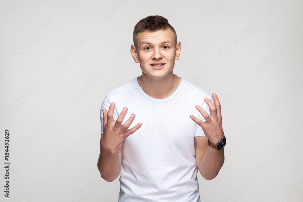 Enrages young boy looking at camera and say why or how? Enrages young boy looking at camera and say why or how?