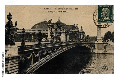 Paris, Alexander III bridge, France, circa 1923, canceled vintage postcard isolated on white background photo