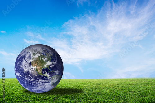 Planet earth beautiful on green grass with cloud sky  world with conservation and resource for renewable  environment concept  Elements of this image furnished by NASA.