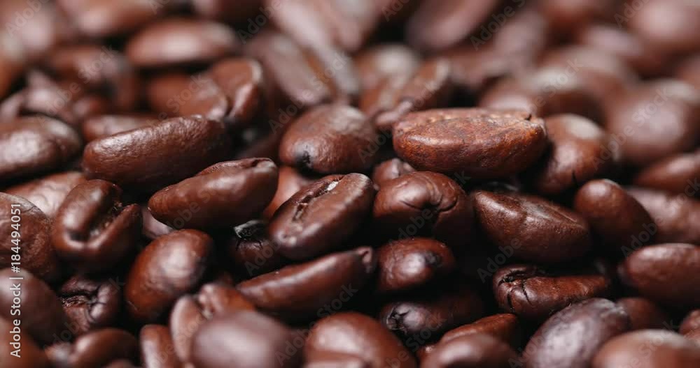 Roasted coffee bean in rotation Roasted coffee bean in rotation