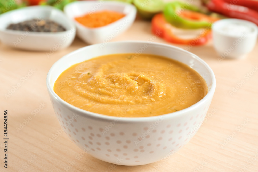 Bowl of homemade lentils creme soup on table, closeup Bowl of homemade lentils creme soup on table, closeup