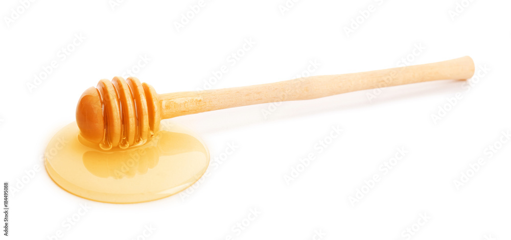 Dipper with honey, isolated on white Dipper with honey, isolated on white