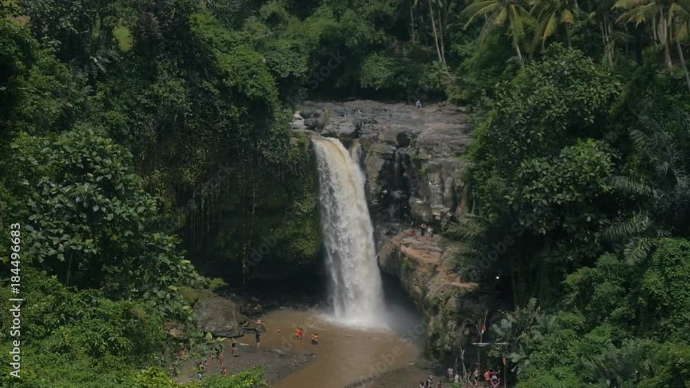 Tegenungan waterfall in jungle on the island of bali, indonesia in slow motion Tegenungan waterfall in jungle on the island of bali, indonesia in slow motion