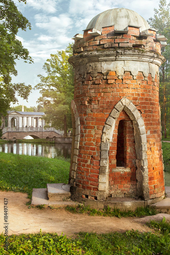 Ruin Tower in Ekaterininsky Park of Tsarskoye Selo in Pushkin, Saint Petersburg on sunny day photo
