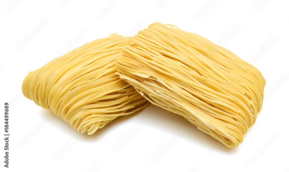 Egg noodles on a white background