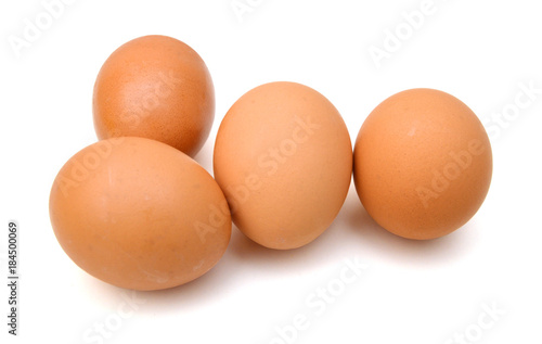 Brown egg on white background