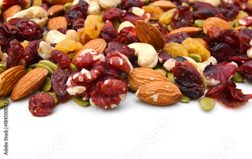 Mix nuts, dry fruits and grapes on a white background