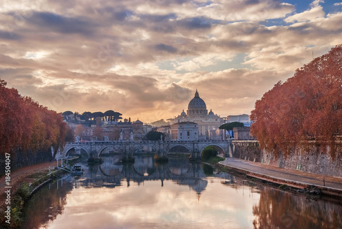 Photography Saint Peter autumn sunset with River Tiber and red leaves in Rome
