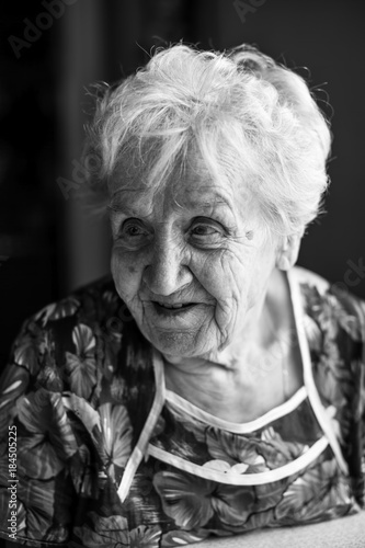 Black and white portrait of an elderly lady.