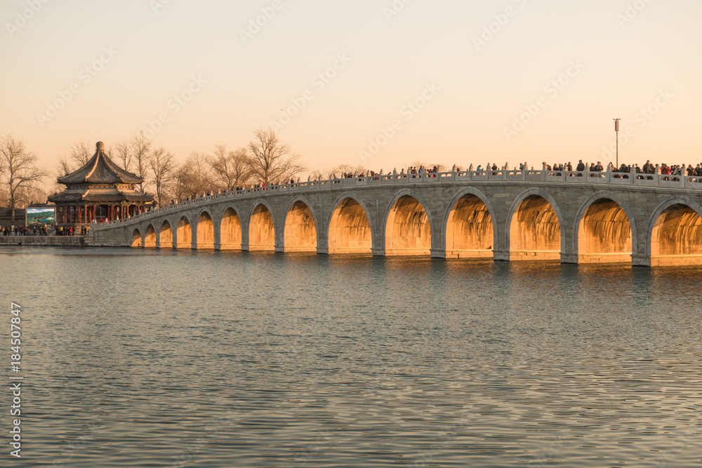 The dusk in Summer Palace, a few days around the winter solstice, the height of the sun is the lowest at the dusk, the sun light can be filled with every hole of the seventeen hole bridge.