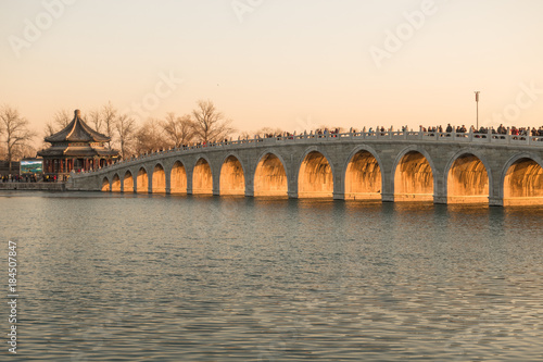 The dusk in Summer Palace, a few days around the winter solstice, the height of the sun is the lowest at the dusk, the sun light can be filled with every hole of the seventeen hole bridge.
