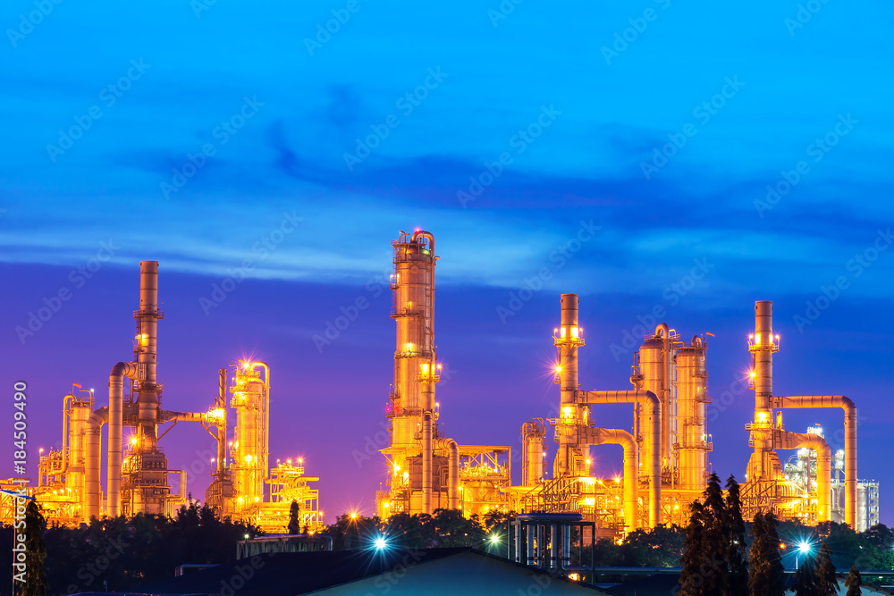 Oil and gas refinery at twilight with reflection - factory - petrochemical plant