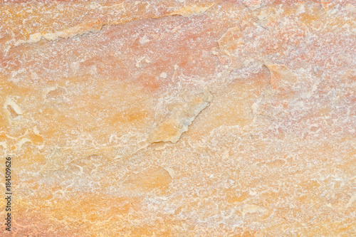 Yellow natural stone texture and background seamless
