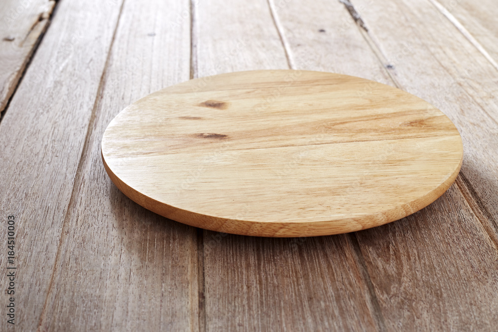 Wood cutting board on wooden background