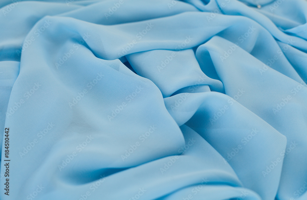 Obraz premium Color blue textil, silk fabric with pleats