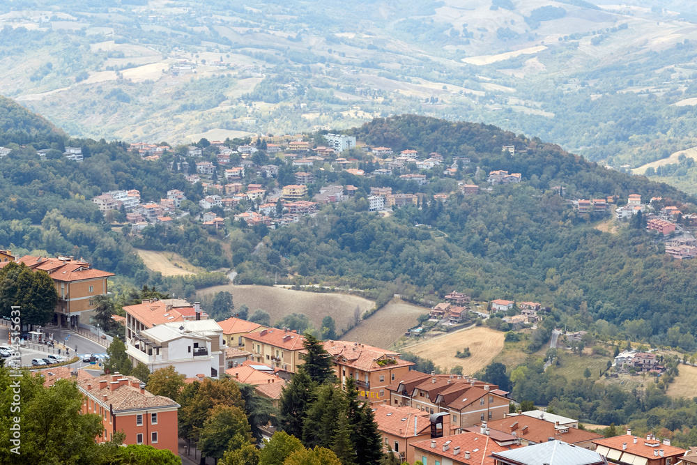 San marino, San Marino - July 10, 2017: View from the top of the view on houses with red roofs.