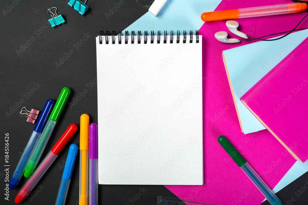 School and office supplies on blackboard School and office supplies on blackboard