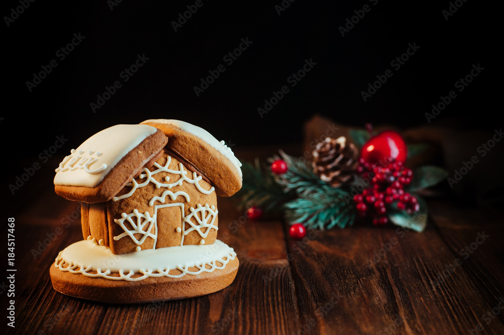 Traditional Christmas gingerbread house on rustic wooden background Traditional Christmas gingerbread house on rustic wooden background