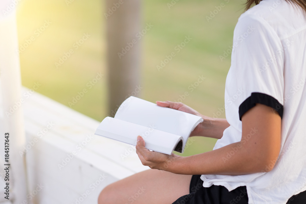 Young woman reading a book at home garden : Concept relax on holiday Young woman reading a book at home garden : Concept relax on holiday