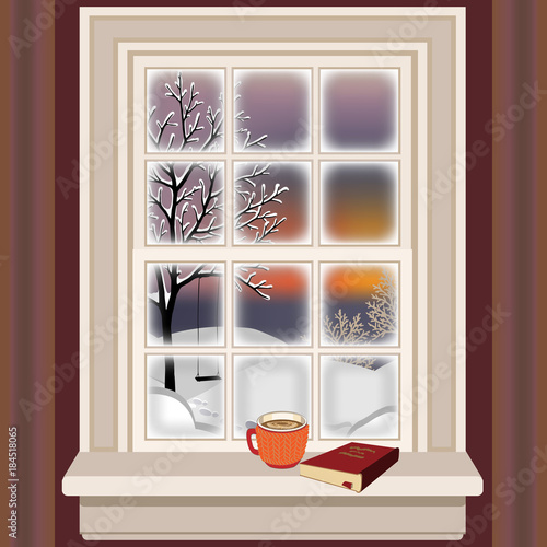 Winter evening, a pleasant outlook from the window over snow covered landscape and tree with swing. Coffee cup and book on inside sill