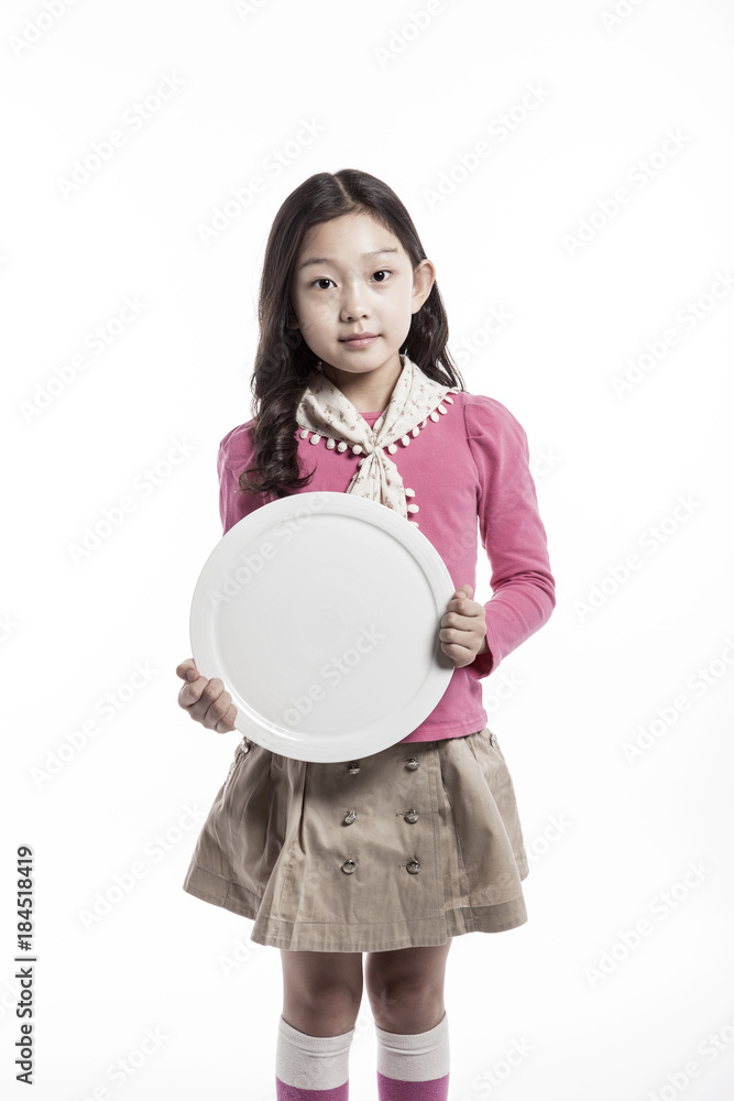 girl(kid) hand hold a empty dish isolated on the white background. girl(kid) hand hold a empty dish isolated on the white background.