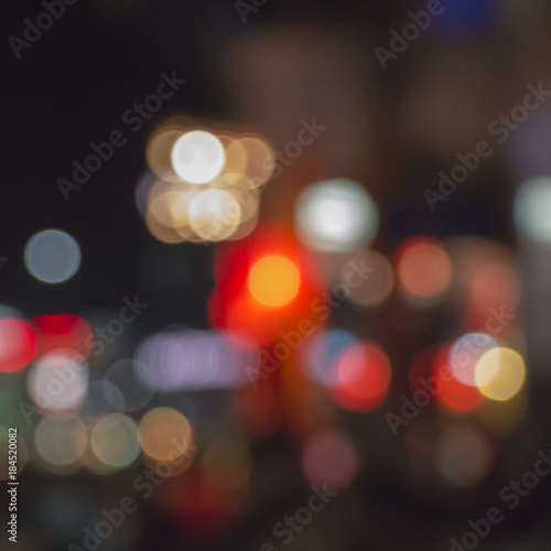 Night bokeh from light on the Road. Street light bokeh. Lights blurred bokeh background from christmas night party for your design. © napatta
