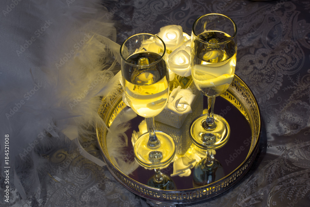 Two glasses of champagne. Romantic room arrangement for a date Two glasses of champagne. Romantic room arrangement for a date