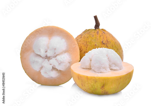 whole and half santol tropical fruit isolated on white background photo