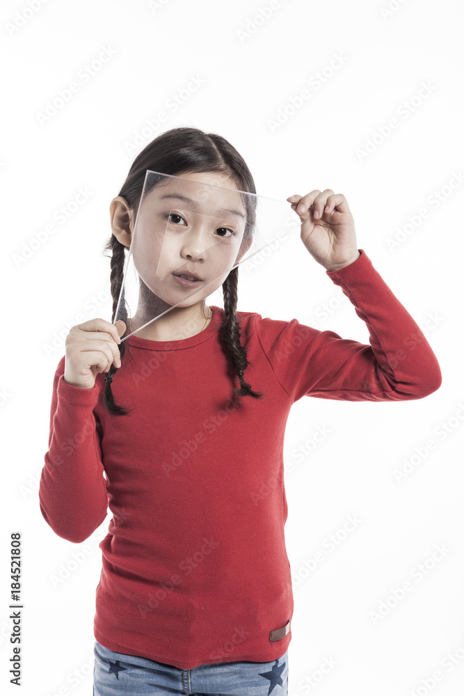 girl(kid) hand hold a triangle ruler isolated on the white background. girl(kid) hand hold a triangle ruler isolated on the white background.