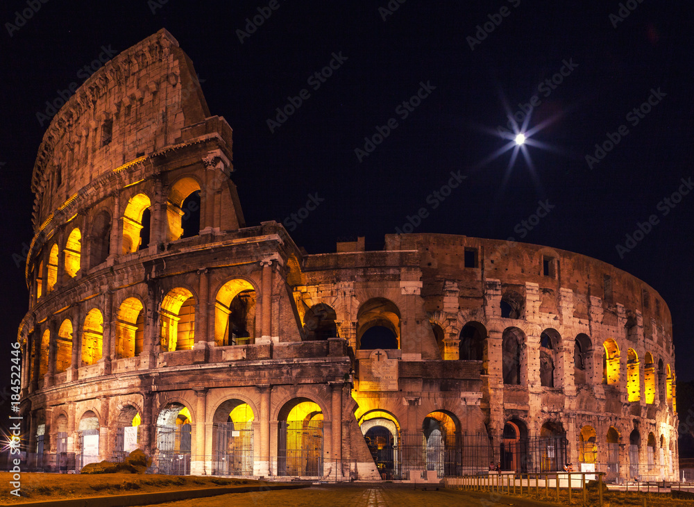 Ancient famous amphitheater in night lights