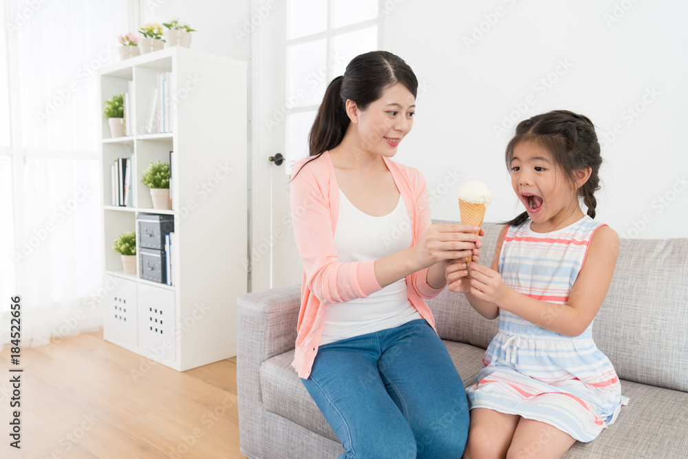 pretty elegant mother giving ice cream dessert pretty elegant mother giving ice cream dessert