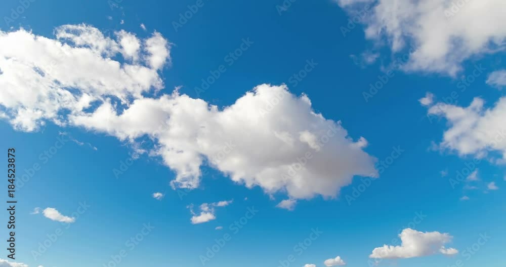 loop of white clouds over blue sky time lapse movement, climate change concept
