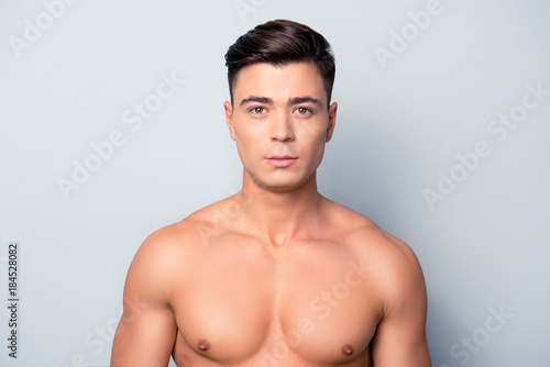 Obraz na plátně Portrait of confident concentrated handsome muscular with perfect ideal skin sha