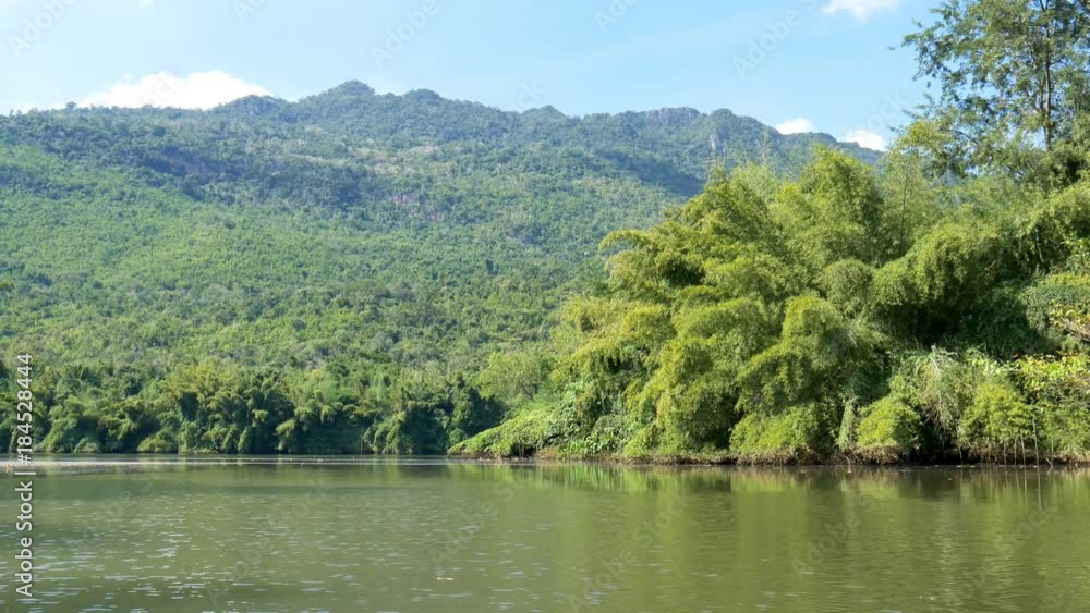 Kwai Yai river with view of mountain and blue sky in Amphoe Srisawat,Kanchanaburi Thailand Kwai Yai river with view of mountain and blue sky in Amphoe Srisawat,Kanchanaburi Thailand