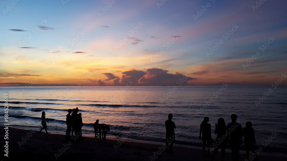 Silhouette of people taking picture of landscape during sunrise Scenic View Of Beach Against Sky During Sunset. Silhouette of people taking picture of landscape during sunrise Scenic View Of Beach Against Sky During Sunset.