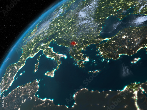 Kosovo on planet Earth in space at night