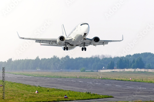Passenger airplane take off runway airport.