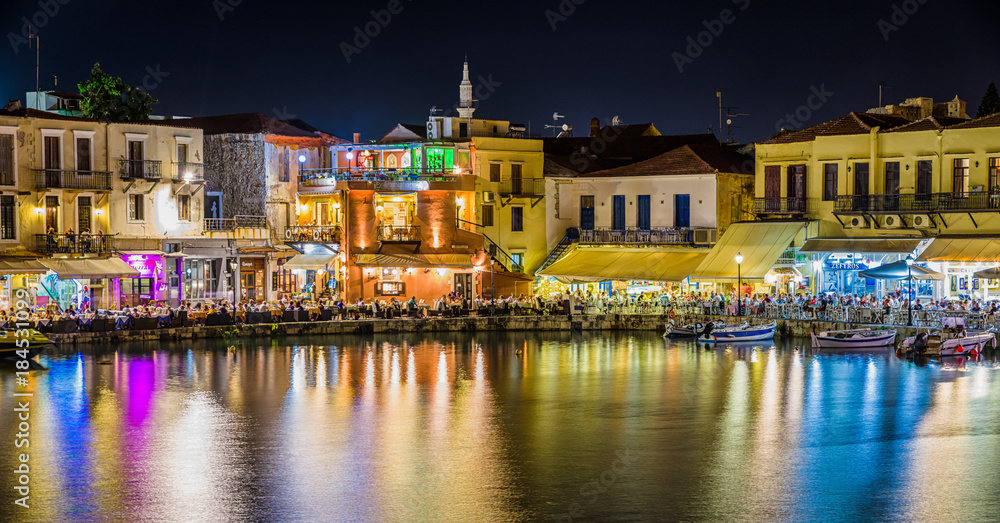 Terrace of restaurant full of people in port of  Rethymno city -Crete, Greece