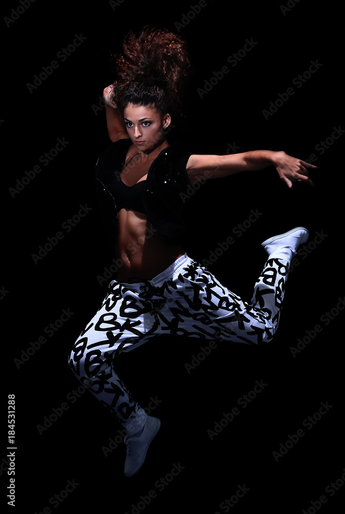 young woman jumping in the style of street dance
