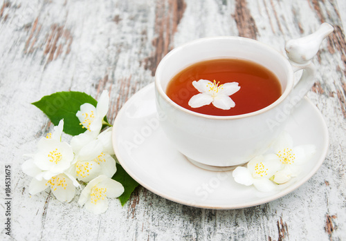 Cup of tea with jasmine flowers